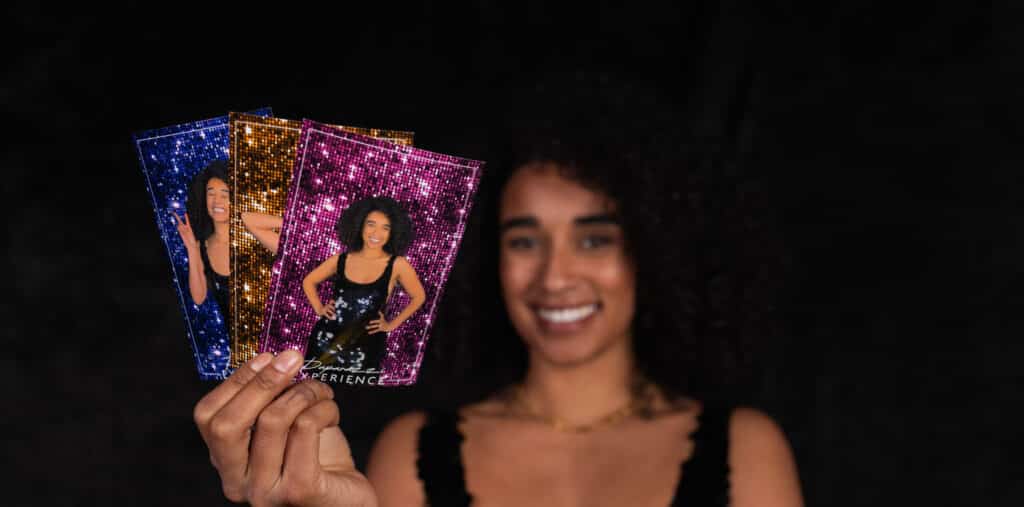 Woman holding photo booth prints