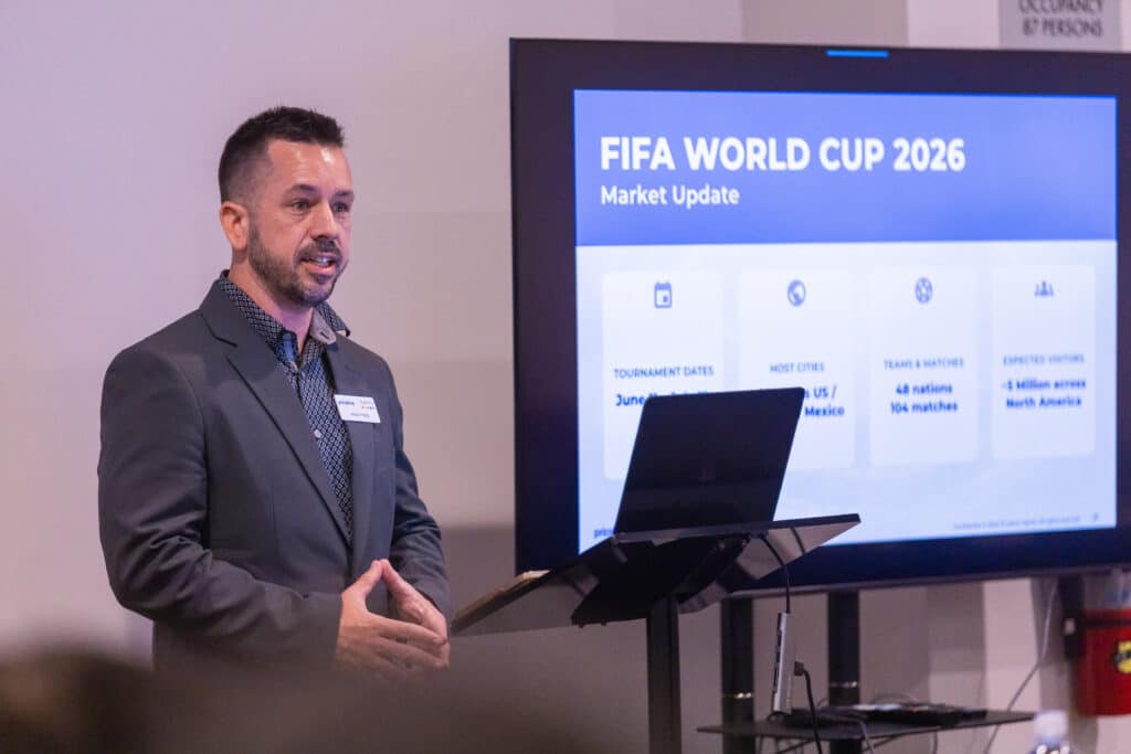 Priceline employee presenting FIFA World Cup 2026 market update at San Francisco conference.