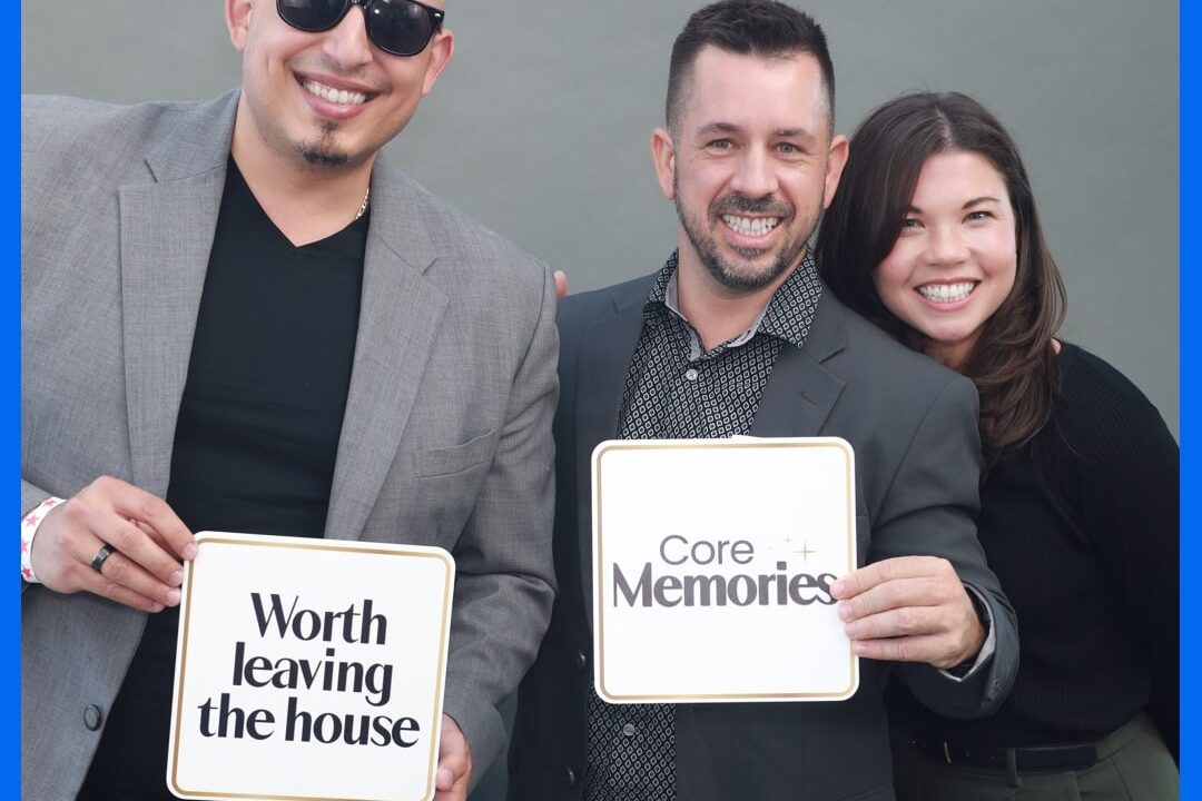 employees posing with photo props